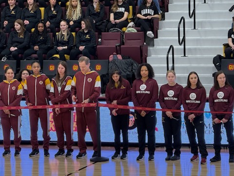 Student-athletes participate in the ribbon cutting ceremony
